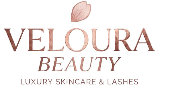 Veloura Beauty logo with a leaf symbol on a white background
